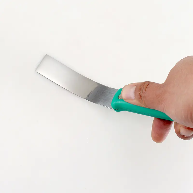 Green plastic handle putty knife